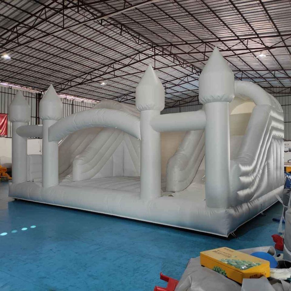 Large white bounce house with double slide